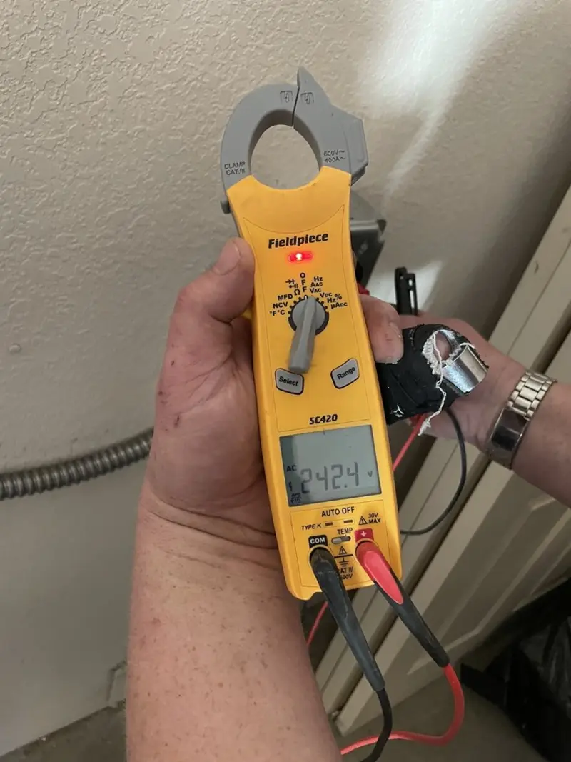 Voltage testing with clamp meter during Circuit Breaker Repair in Huntington Woods
